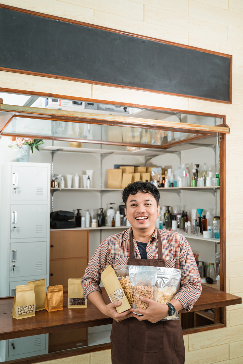 Portrait Young Man Selling Packaged Products