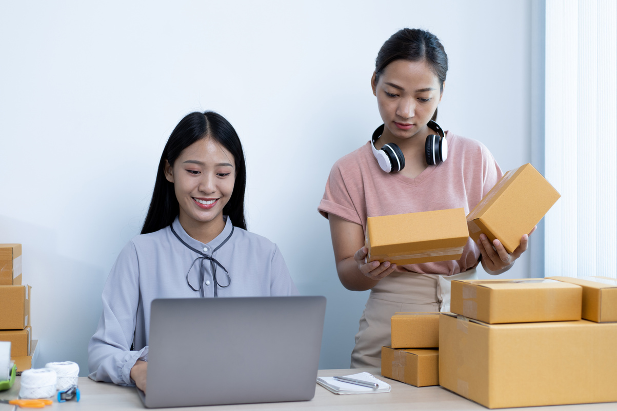 Women Selling Online and Organizing Parcel Boxes